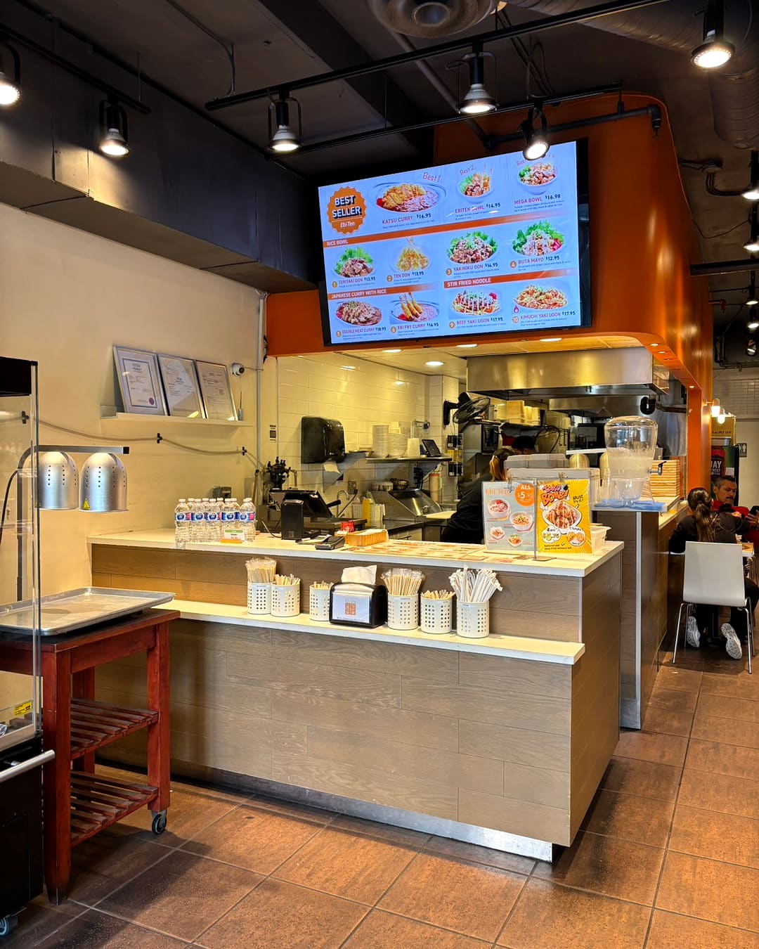 Inside Ebi Ten — the counter and menu screen on Robson Street